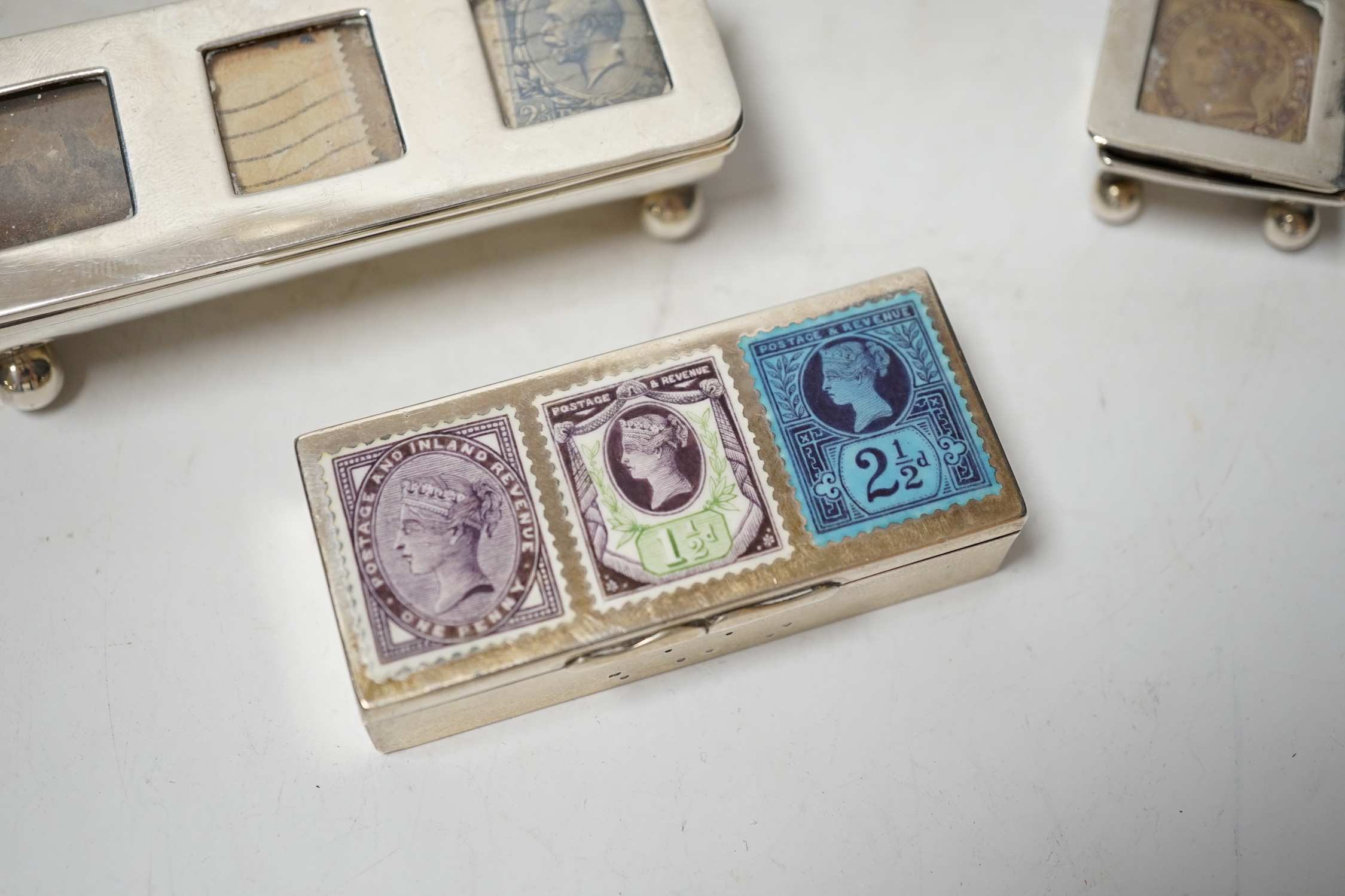 Four assorted late 19th/early 20th century silver stamp boxes, including triple compartment, one with enamelled 'stamps', largest 9cm and one plated stamp box.